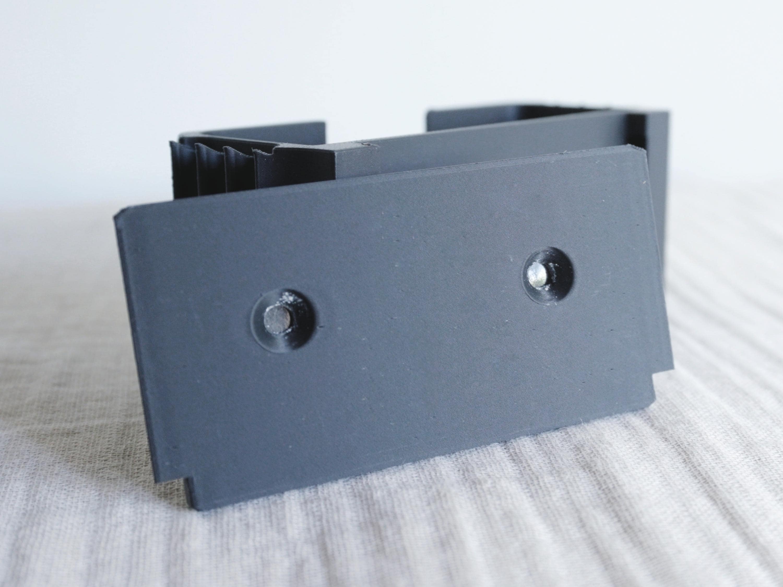 Wall-Mounted Phone Holder with Integrated Cable Management – Minimalist Bedside Charging Dock